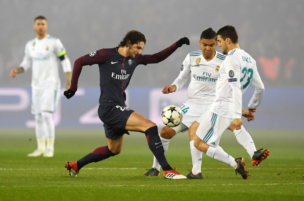 MIDFIELD MAESTRO : Kovacic tackling Adrien Rabiot in their Round of 16 match en route to winning a third consecutive Champions League trophy in 2018