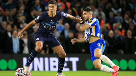 KEEP AWAY: Rodri holds off Maupay.