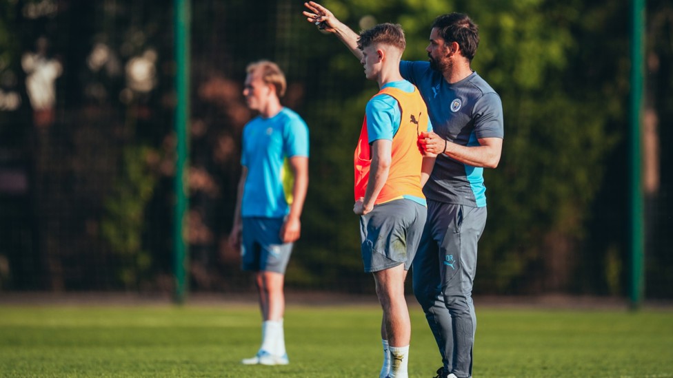 WORDS OF WISDOM : Oliver Reiss offers instructions to Rhys Thomas. 