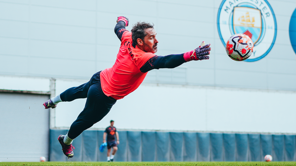 FULL STRETCH : Scott Carson dives to save a shot