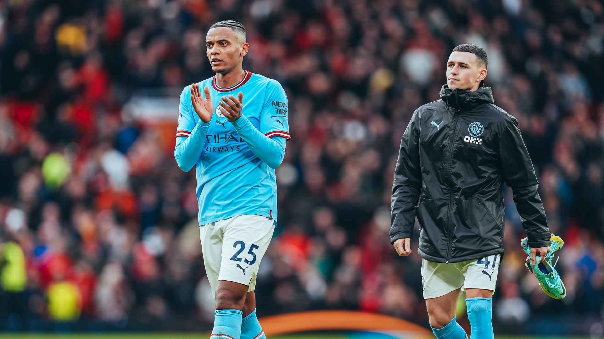 FRUSTRATION: Manuel Akanji and Phil Foden salute the City fans at full time