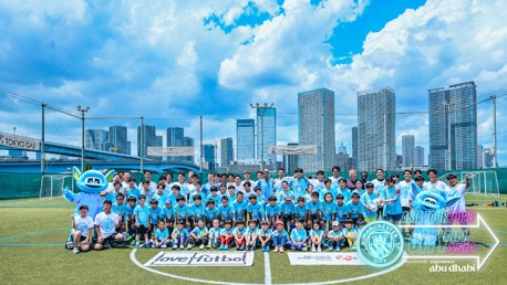 Players visit community football festival in Tokyo