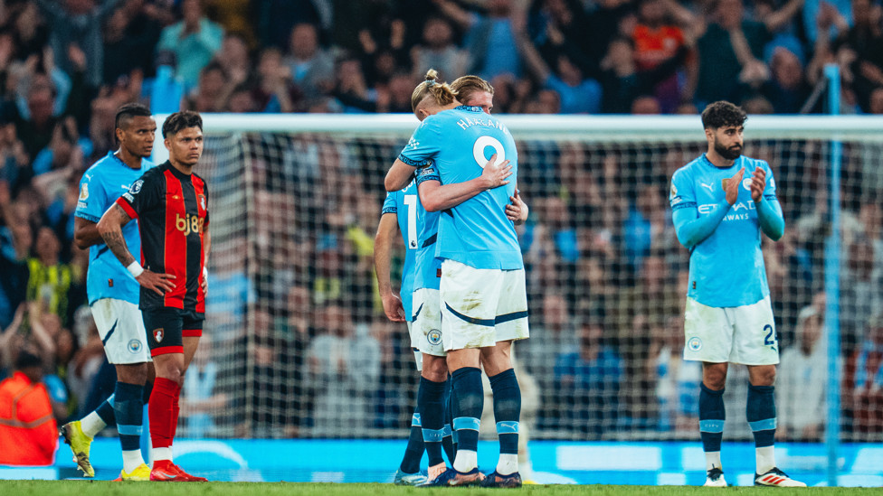 HAALAND HUG : A warm embrace for KDB as he leaves the pitch.
