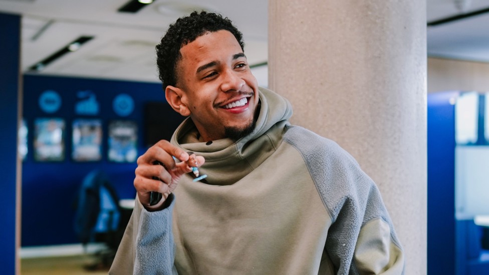 WING WIZARD : Savinho poses for a shot with his mini action figure!