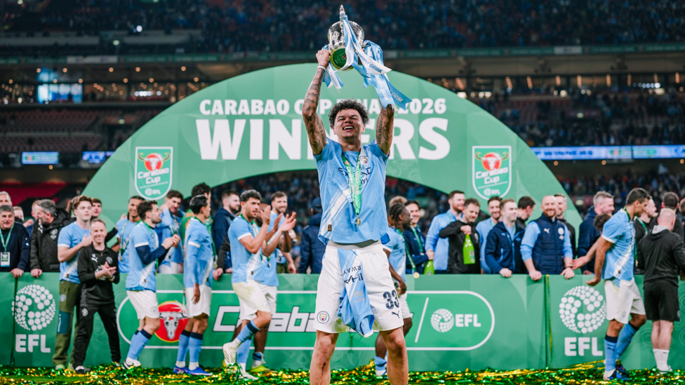 CUP FINAL HERO : O'Reilly lifts the trophy!