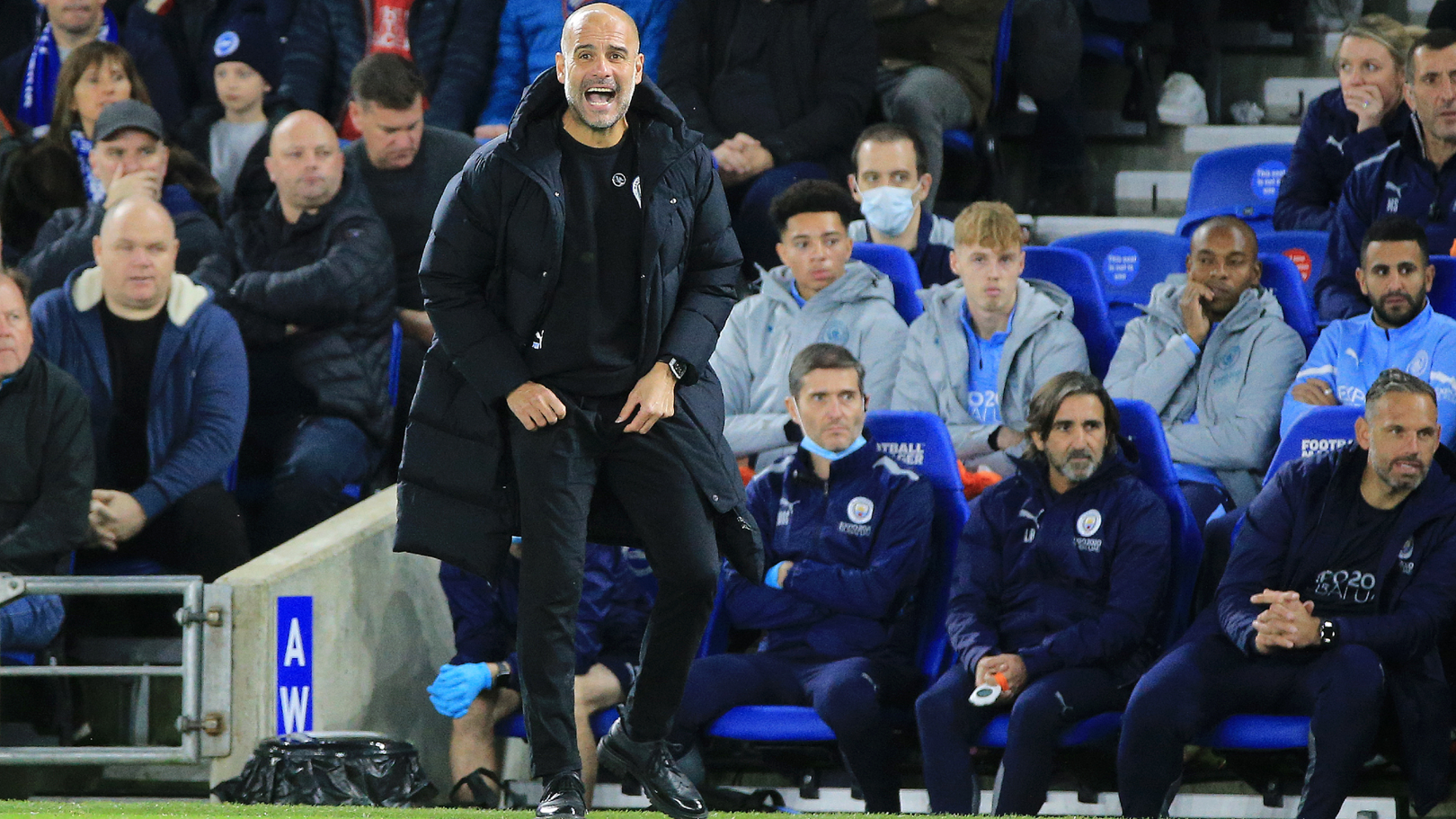 PEP TALK: The boss passes on instructions from the touchline.