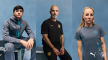 Three individuals modeling Manchester City and Puma apparel against a blue background.