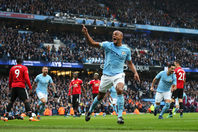 Vincent Kompany celebrates his header against Manchester United