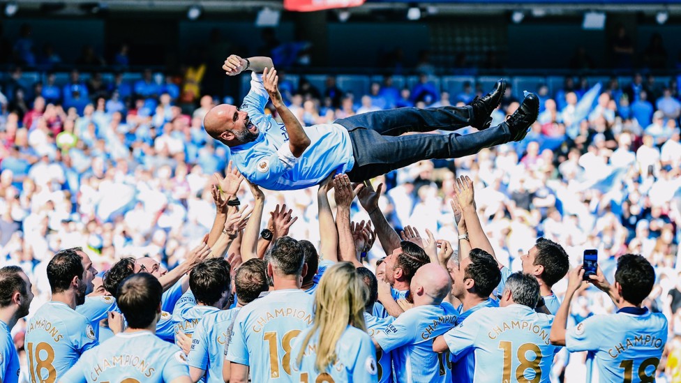 BUMPS : The boss gets the celebratory treatment from his players and staff