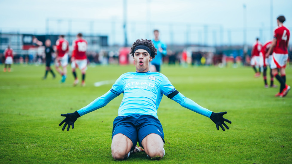 DOWN THE LENS : Luca Fletcher pulls off a fantastic knee slide during City's win over United. 