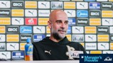 A person is speaking at a press conference with Manchester City sponsors like Etihad and Puma in the background.