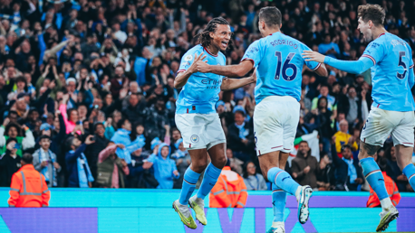 ALL SMILES: The players show their delight.