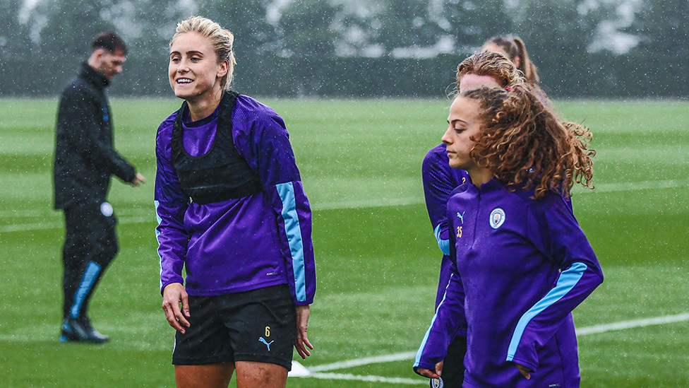 HAPPY FEET : Skipper Steph Houghton tries to keep warm while Matilde Fidalgo acclimatises to the Mancunian weather