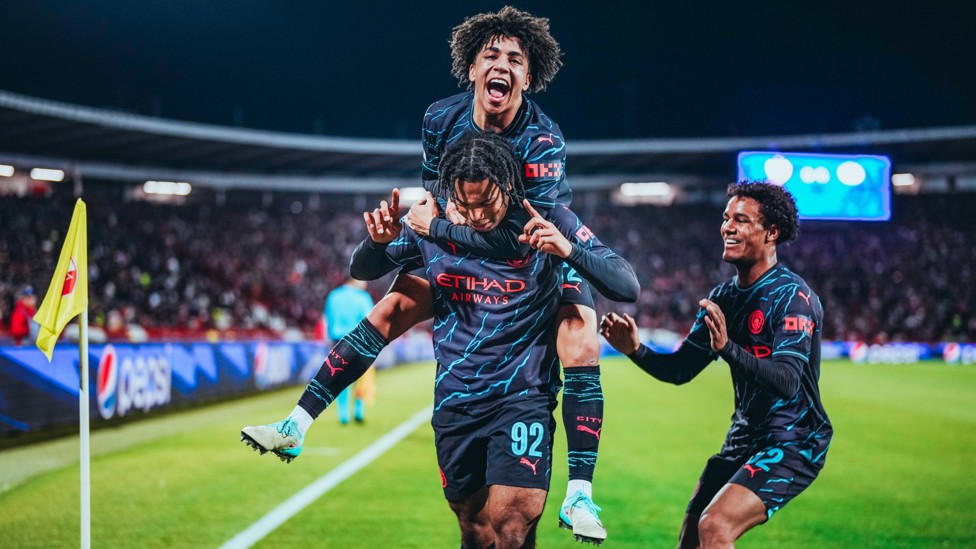 ACADEMY BOYS : Rico celebrates with Oscar Bobb and former Blue Micah Hamilton during a night of delight in the Champions League.