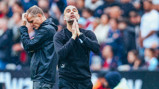TENSE: The boss reacts on the touchline...