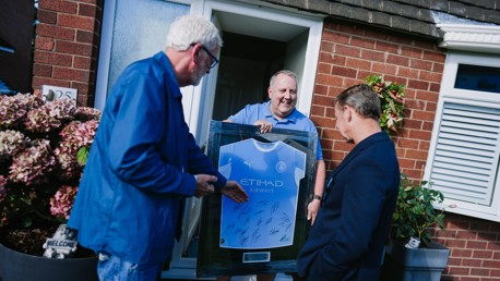 Squad signed shirts gifted to Greater Manchester's largest Official Supporters Clubs