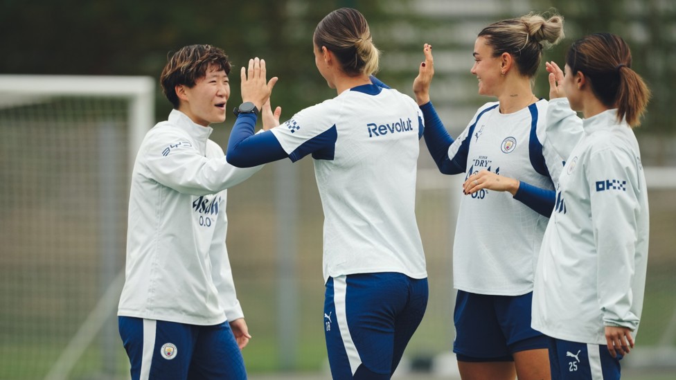 ALL TOGETHER NOW: Aoba Fujino shares high fives with her team mates.
