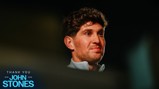 An image featuring text 'Thank You John Stones 2016-2026' with a blurred face. The text is in electric blue against a dark background.