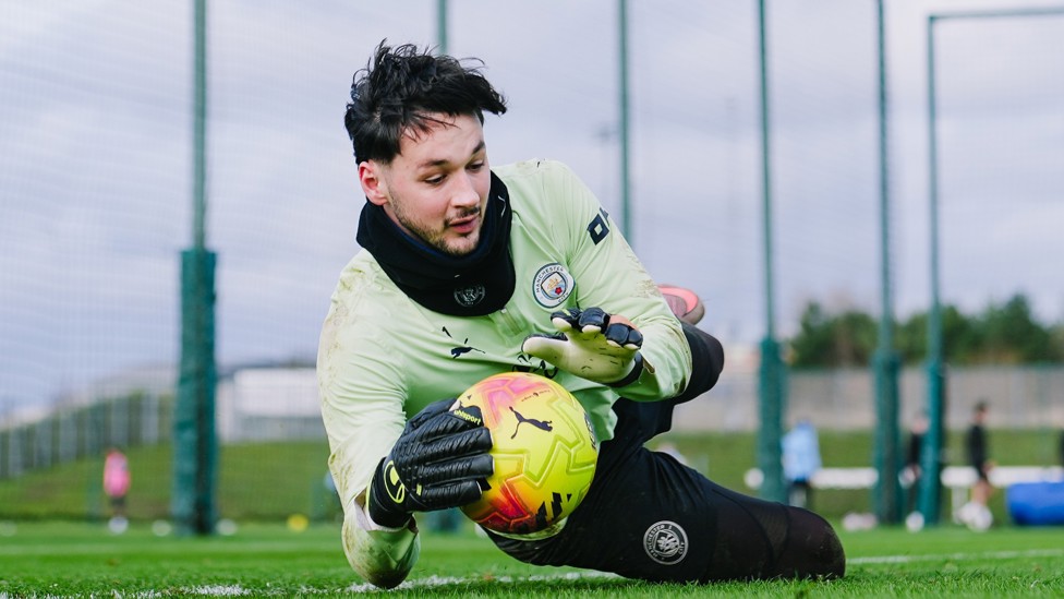 DIVING ON IT : Trafford holds the ball well