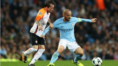 AT FULL STRETCH: David Silva battles it out against Shakhtar Doneskt