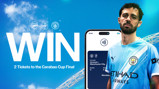 Promotional graphic for a contest to win 2 tickets to the Carabao Cup Final between Arsenal and Manchester City, featuring a player in City kit and a phone displaying ticket details.