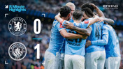 Manchester City players celebrate after a 1-0 victory over Chelsea. The score is displayed with Chelsea 0 and Manchester City 1 along with team logos.