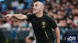 A person coaching wearing a black Manchester City shirt with an 'Asia Tour '26' logo on the side.