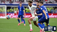 England and Croatia players contest a soccer ball during a match, with focus on England player wearing number 3 jersey.
