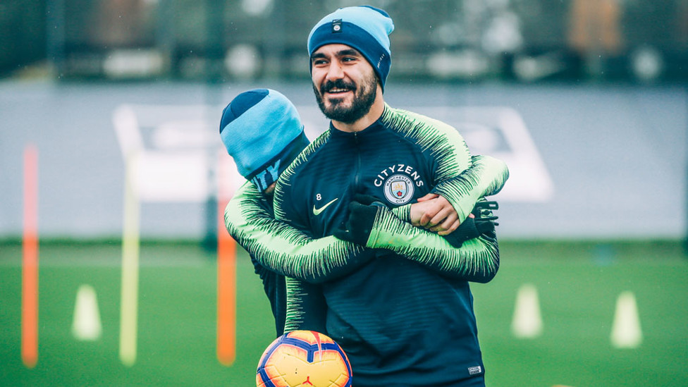 GUESS WHO? A Mystery Blue hugs Ilkay Gundogan