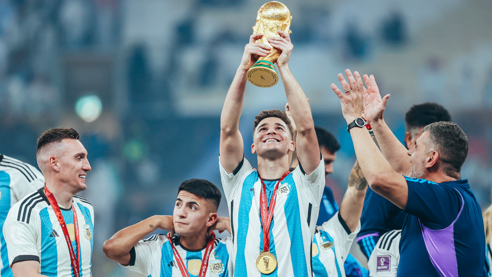CHAMPION : La Arana lifts the World Cup trophy with his international colleagues.  