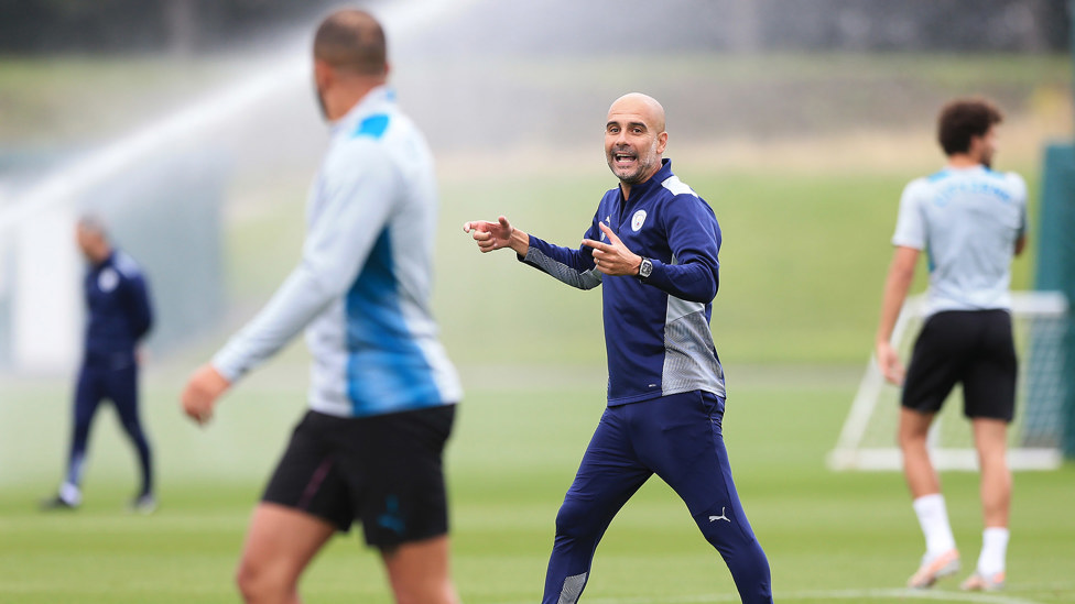 BOSSING IT: Pep Guardiola shares his wisdom with the team