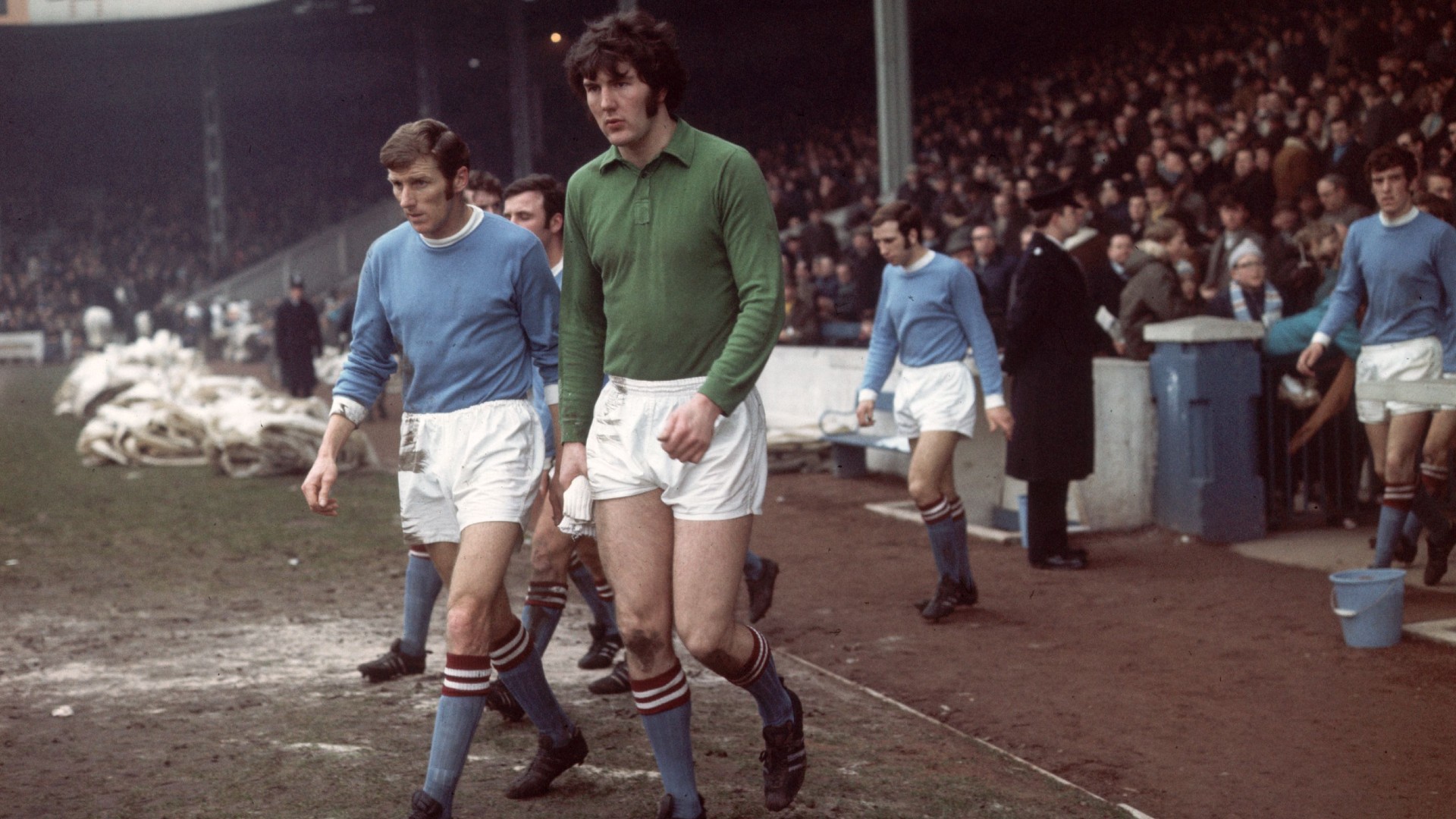 WE MEAN BUSINESS : Joe Corrigan walks out onto the pitch before a 1970 game against Ipswich Town.