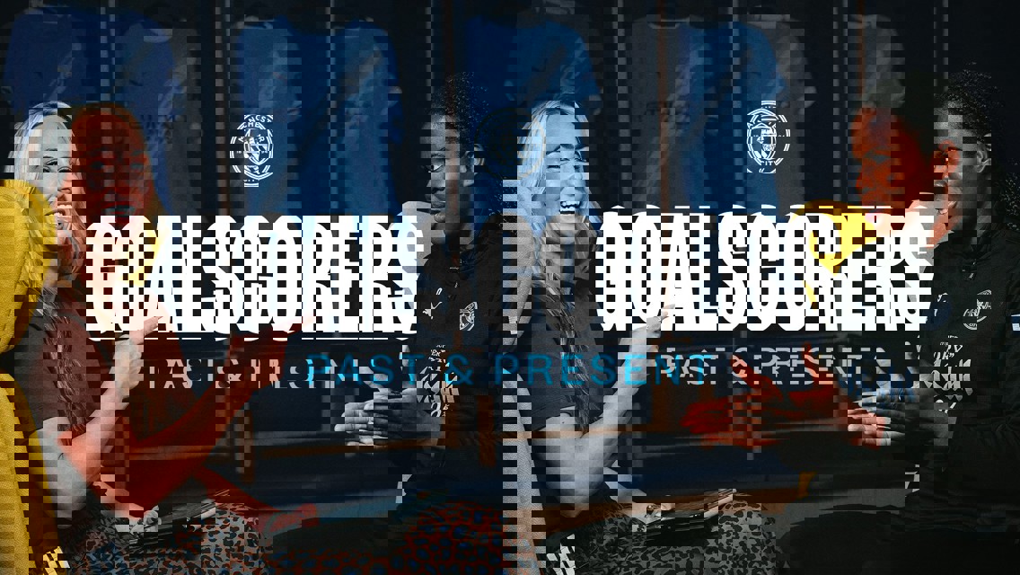 Two individuals in conversation with Manchester City shirts displayed in the background. Text reads 'Goalscorers Past & Present' with the Manchester City logo above.