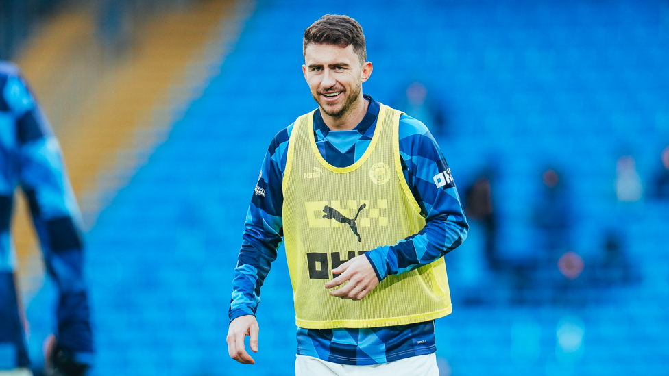 LAPORTING FOR DUTY : Aymeric gets loose during the pre-match warm up.