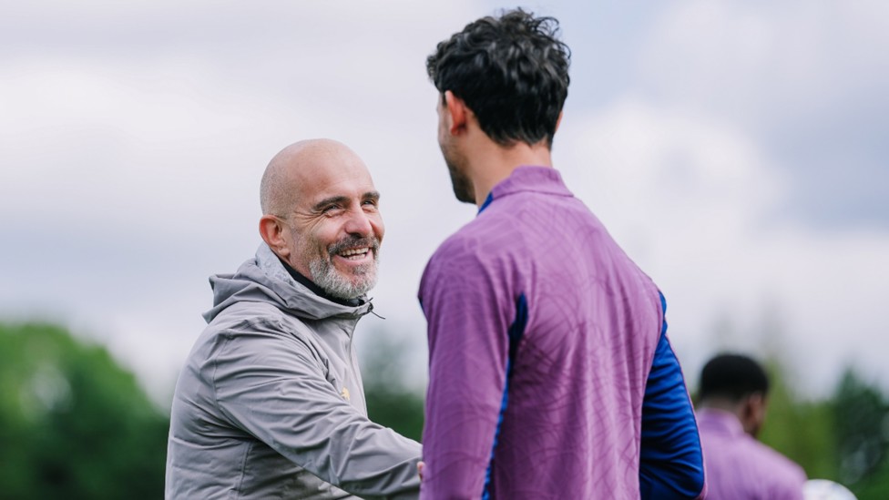 SMILES BETTER: Enzo Maresca shares in a light hearted moment with Matheus Nunes.