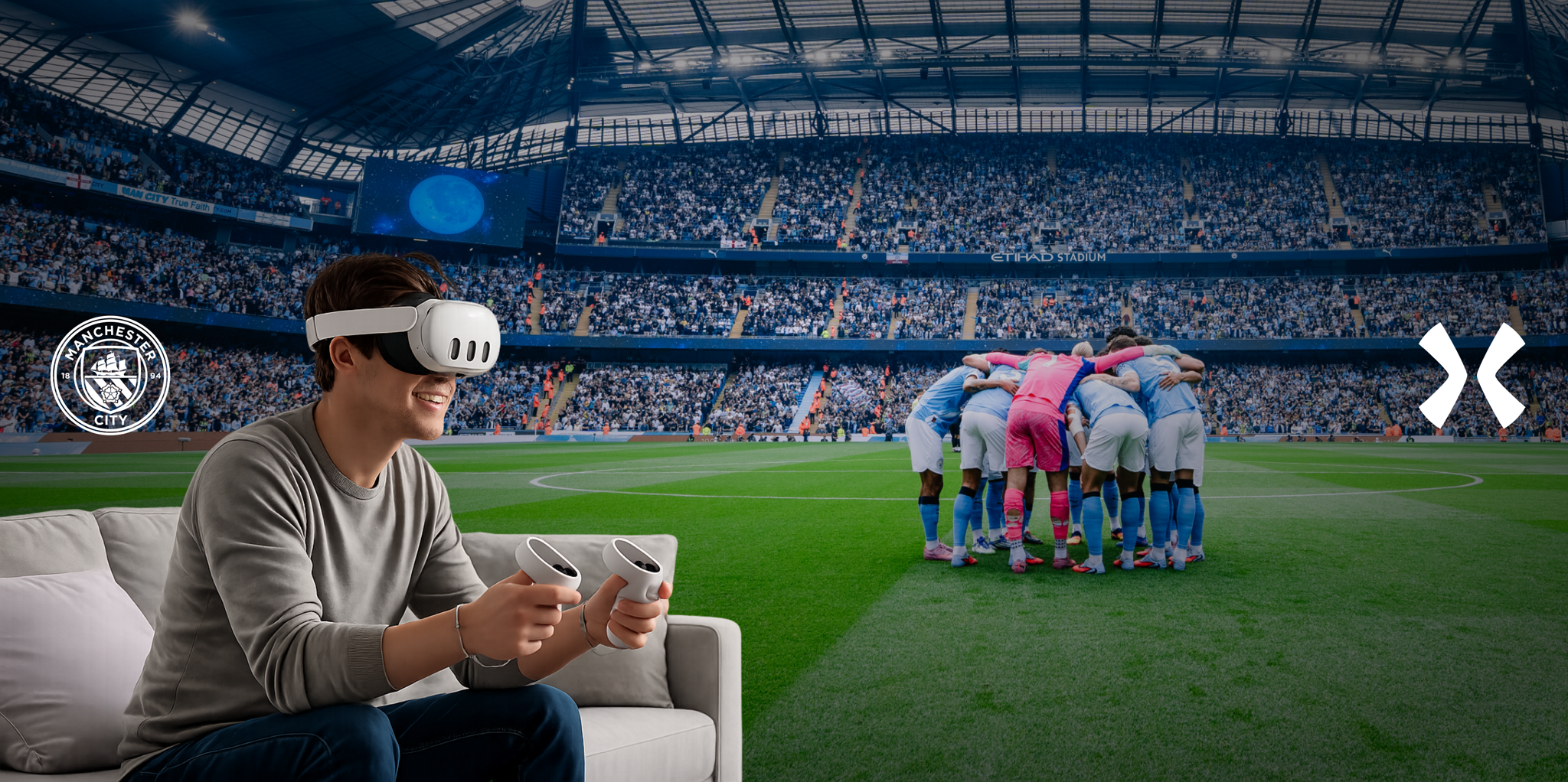 A person wearing VR headset and controllers sits on a couch with Manchester City football team huddling in a stadium.
