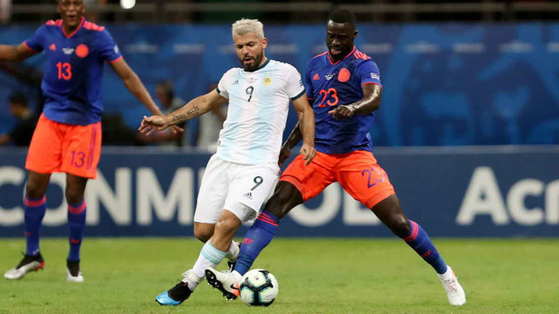ACTION MAN: Sergio Aguero looks to gain possession from Colombia's Davinson Sanchez