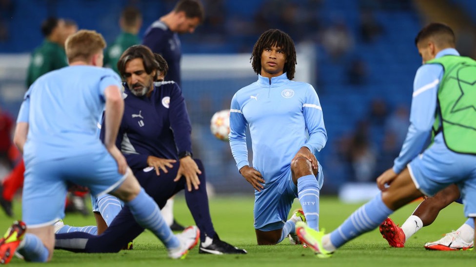 GET LOOSE : Ake and co stretch their muscles during the pre-match warm up.