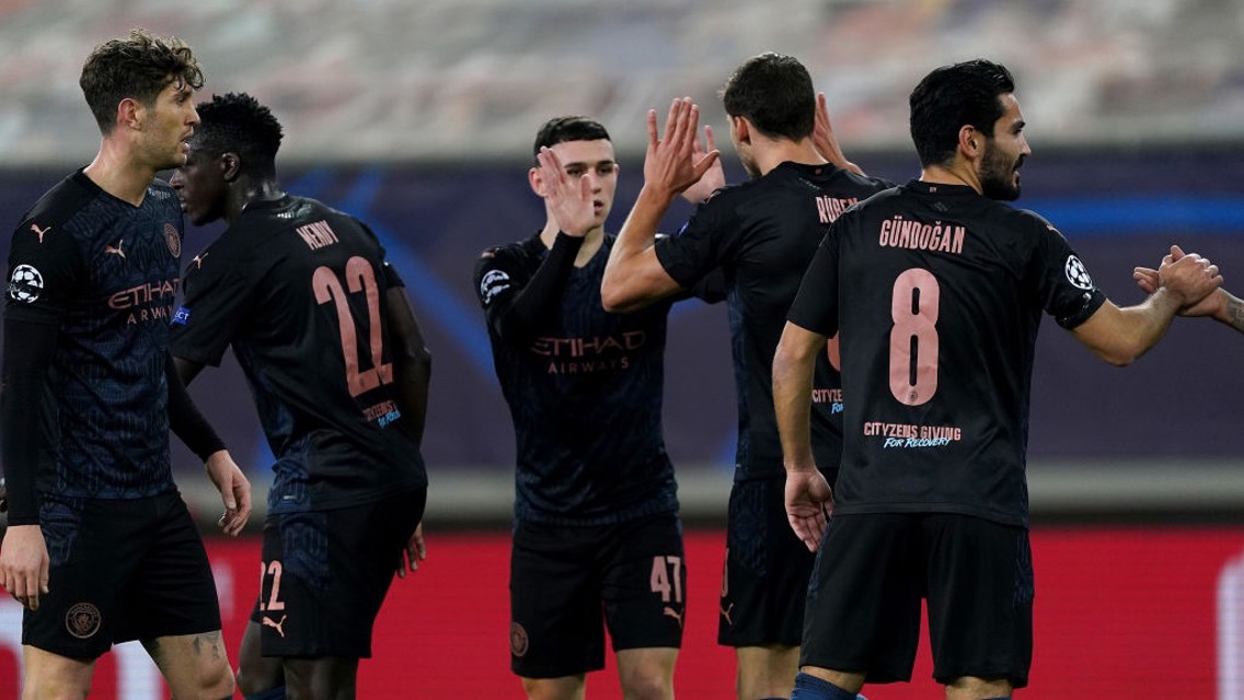 SHARE THE LOVE: They players gather to congratulate Foden after his neat finish.