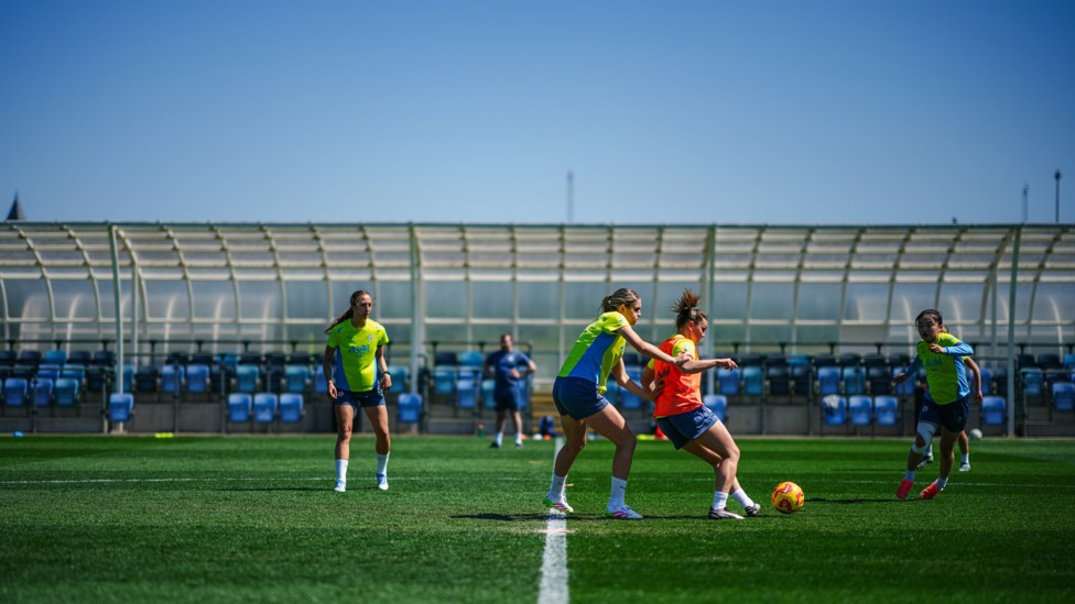 HARD YARDS : The girls limber up in the Manchester sun